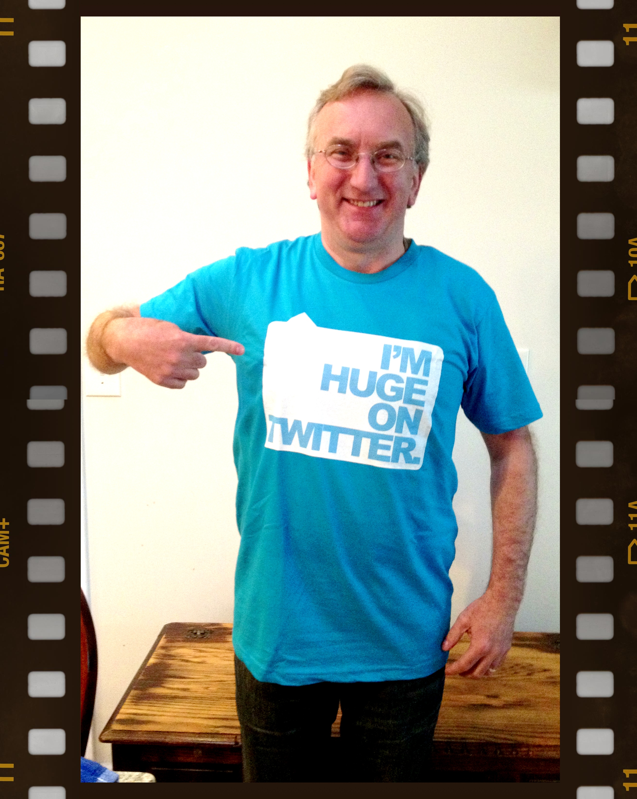 Nigel with a t-shirt given to him by a sales exec
